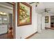 Hallway with large painting and access to other rooms at 39645 Turek Ln, Umatilla, FL 32784