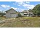 Simple house exterior with attached garage and small yard at 39645 Turek Ln, Umatilla, FL 32784