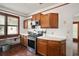 Stainless steel appliances and wood cabinets in the kitchen at 39645 Turek Ln, Umatilla, FL 32784