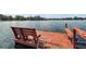 Lake dock with bench and ladder for easy access at 39645 Turek Ln, Umatilla, FL 32784