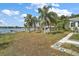 Charming lakefront home with dock and lush landscaping at 39645 Turek Ln, Umatilla, FL 32784