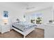 Bright bedroom with white furniture and ceiling fan at 4348 Tuscaloosa Path, The Villages, FL 32163