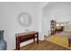 Bright entryway with console table and mirror, view of living room at 4348 Tuscaloosa Path, The Villages, FL 32163