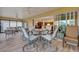 Sunroom with table and chairs, view of kitchen at 4348 Tuscaloosa Path, The Villages, FL 32163