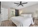 Spacious bedroom with a comfortable bed and ensuite bathroom access at 460 Brook Ridge Cir, Minneola, FL 34715