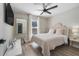 Cozy bedroom with a queen-size bed and built-in shelving at 460 Brook Ridge Cir, Minneola, FL 34715