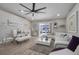 Bright and airy living room with white sectional sofa and glass dining table at 460 Brook Ridge Cir, Minneola, FL 34715