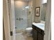 Clean bathroom with a walk-in shower and modern vanity at 5078 Lawler Loop, The Villages, FL 32163