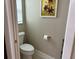 Powder room with toilet and updated vanity at 5078 Lawler Loop, The Villages, FL 32163