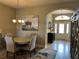 Dining area with round table, four chairs, and area rug at 5078 Lawler Loop, The Villages, FL 32163