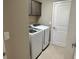 Bright laundry room with washer and dryer at 5078 Lawler Loop, The Villages, FL 32163