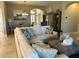 Spacious living room with sectional sofa and large TV at 5078 Lawler Loop, The Villages, FL 32163