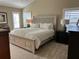 Spacious main bedroom with ample natural light and a large bed at 5078 Lawler Loop, The Villages, FL 32163