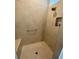 Large walk-in shower with bench seat and grab bar at 5078 Lawler Loop, The Villages, FL 32163