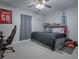 Stylish bedroom with gray platform bed and gaming chair at 51 Cr 532B, Bushnell, FL 33513