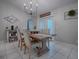 Bright dining room featuring a rustic wooden table at 51 Cr 532B, Bushnell, FL 33513