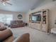 Comfortable living room with built-in shelving and TV at 51 Cr 532B, Bushnell, FL 33513