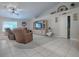 Spacious living room featuring a large TV and comfortable seating at 51 Cr 532B, Bushnell, FL 33513