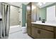 Well-lit bathroom with neutral tile, modern vanity and fixtures, and a shower-tub combo at 5221 Blanket Flower St, Apopka, FL 32712