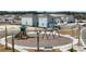 Aerial view of a neighborhood playground, featuring modern equipment and surrounded by new homes at 5221 Blanket Flower St, Apopka, FL 32712