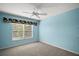 Spacious bedroom with a ceiling fan and window coverings at 526 Kingston Way, The Villages, FL 32162