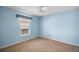 Bright bedroom with light blue walls and ceiling fan at 526 Kingston Way, The Villages, FL 32162