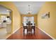 Bright dining room with hardwood floors and a chandelier at 526 Kingston Way, The Villages, FL 32162