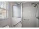 Shower stall with glass enclosure and grab bar at 526 Kingston Way, The Villages, FL 32162