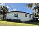 Home exterior boasting a well-maintained lawn and charming accents at 534 Palo Verde Dr, Leesburg, FL 34748