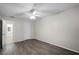 Bedroom with wood-look floors, ceiling fan and bathroom access at 548 Cascade Cir # 100, Casselberry, FL 32707