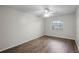 Well-lit bedroom featuring wood-look floors and a ceiling fan at 548 Cascade Cir # 100, Casselberry, FL 32707