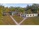 Aerial view shows a large home with a pool and lush landscaping at 5526 Parkdale Dr, Orlando, FL 32839