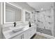 Modern bathroom with double sinks and walk-in shower at 5526 Parkdale Dr, Orlando, FL 32839