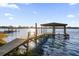 Private dock with covered boathouse offering stunning lake views at 5526 Parkdale Dr, Orlando, FL 32839