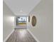 Long hallway with large window overlooking the water at 5526 Parkdale Dr, Orlando, FL 32839