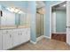 Bathroom with a vanity, shower and access to other rooms at 6026 Landings Blvd, Lady Lake, FL 32159