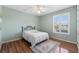 Charming bedroom with wood floors, ceiling fan, and window at 6026 Landings Blvd, Lady Lake, FL 32159