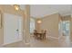 Bright dining room with a charming chandelier and an oval dining table at 6026 Landings Blvd, Lady Lake, FL 32159