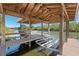 Detailed view of covered dock and boat lift at 6026 Landings Blvd, Lady Lake, FL 32159