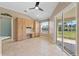 Bright kitchen nook with built-in cabinetry and access to a patio at 6026 Landings Blvd, Lady Lake, FL 32159