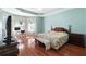 Large main bedroom with hardwood floors and ample natural light at 6026 Landings Blvd, Lady Lake, FL 32159