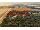 Aerial view of property showing home, land, and nearby lake at 6832 Maryland Ave, Groveland, FL 34736