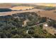 Aerial view of property showing house, land, and lake at 6832 Maryland Ave, Groveland, FL 34736