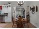 Bright dining area with wooden table and chairs near kitchen and screened porch at 6832 Maryland Ave, Groveland, FL 34736