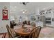 Country style dining area with wooden table and chairs near kitchen and living room at 6832 Maryland Ave, Groveland, FL 34736