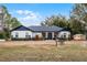 Beautiful craftsman style home with a large front yard and detached shed at 6832 Maryland Ave, Groveland, FL 34736