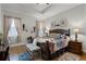 Main bedroom with a king-size bed and wood furniture at 6832 Maryland Ave, Groveland, FL 34736