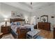 Main bedroom with a king-size bed and wood furniture at 6832 Maryland Ave, Groveland, FL 34736