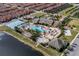 Resort-style community pool, tennis courts, playground, and clubhouse at 8955 Coco Palm Rd, Kissimmee, FL 34747