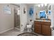 Bathroom with shower, toilet and granite vanity at 8955 Coco Palm Rd, Kissimmee, FL 34747